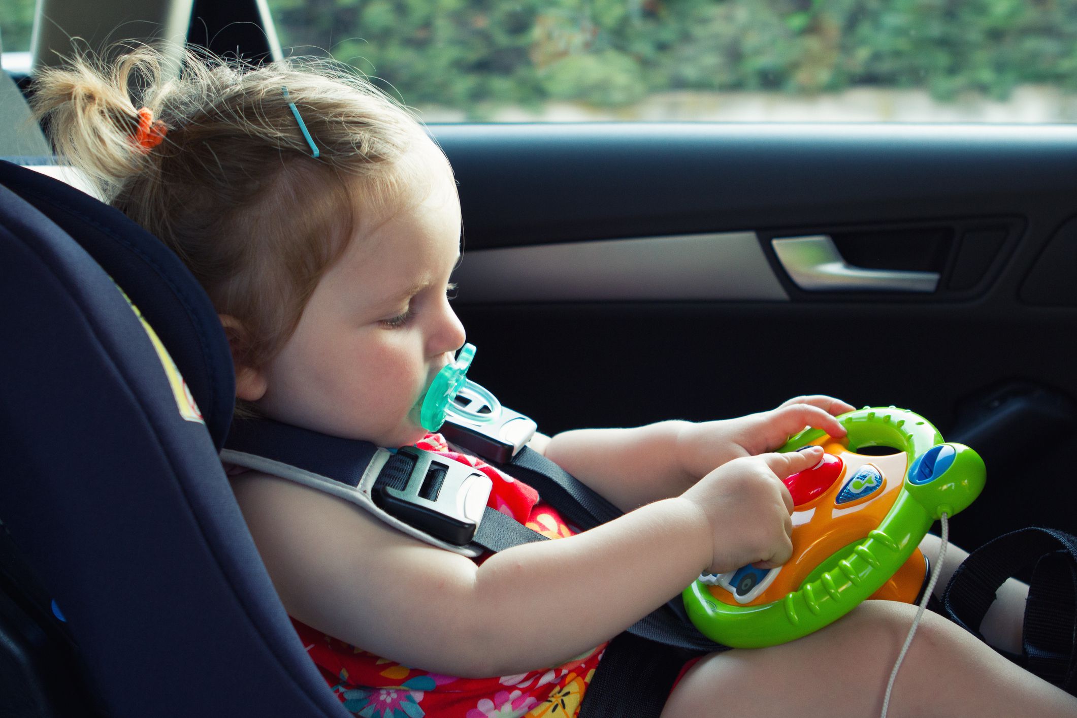 how to burp a baby in a car seat
