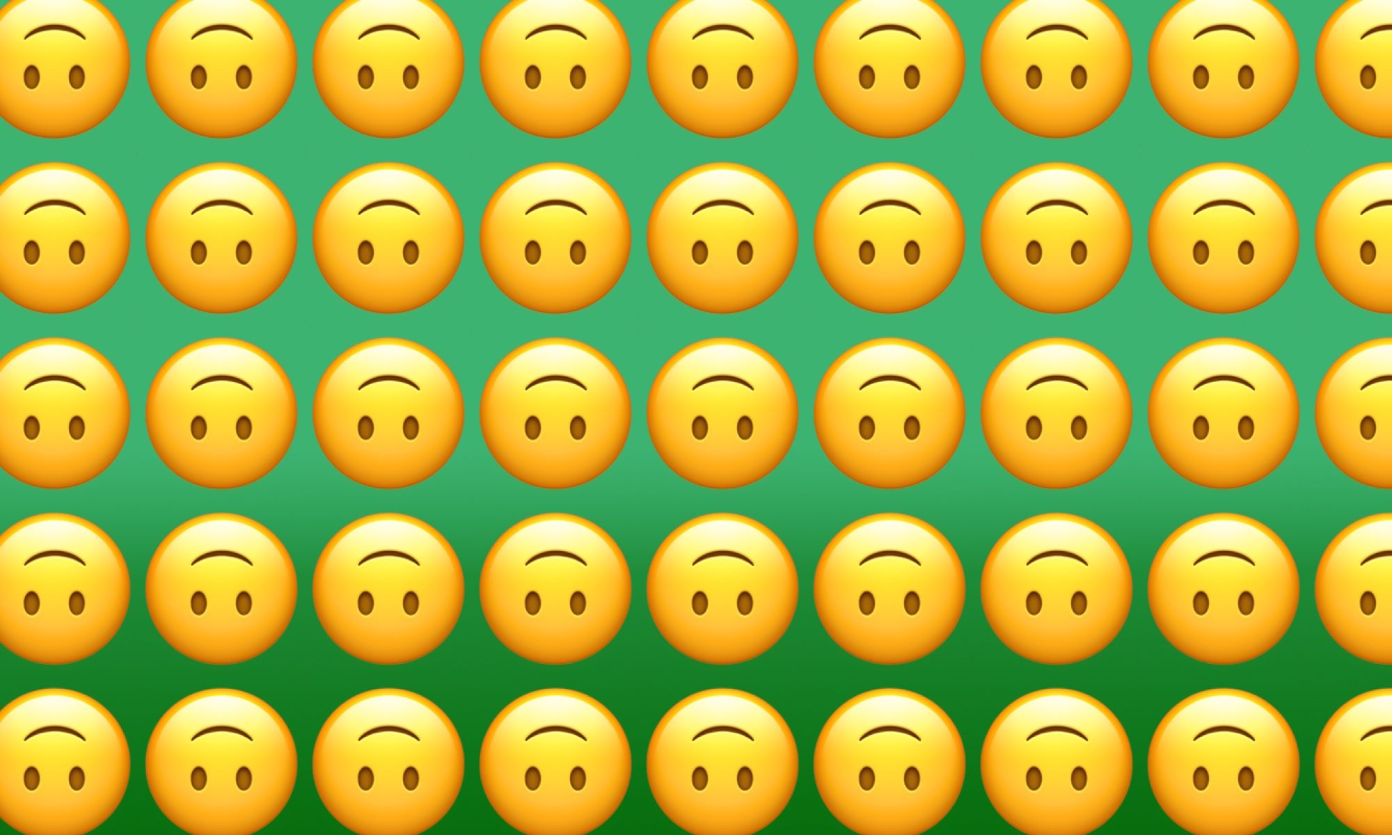 what does the upside-down smile emoji mean