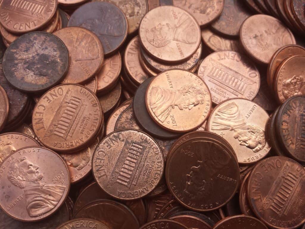 how much does a dollar in pennies weigh